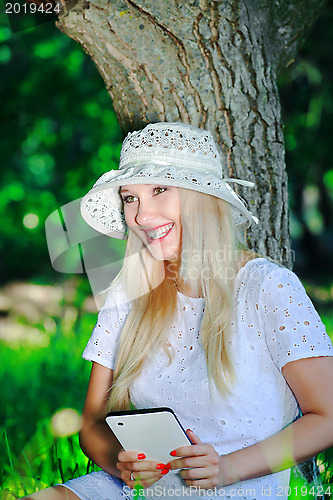 Image of Beautiful girl with a Tablet PC