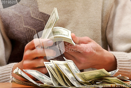 Image of  Cash dollars in hands