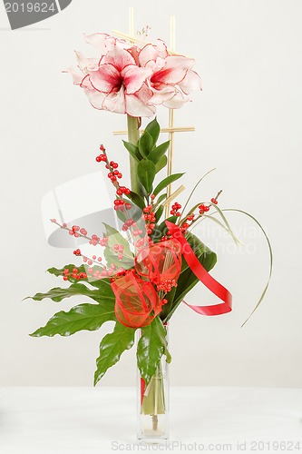 Image of bouquet of pink lily flower in vase on white