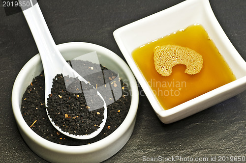 Image of black cumin seeds and black cumin oil