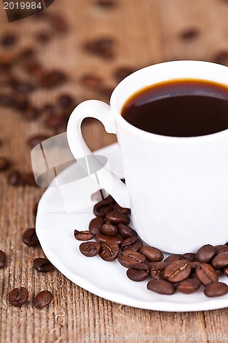 Image of cup of coffee and beans 