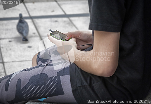 Image of Young girl with mobile