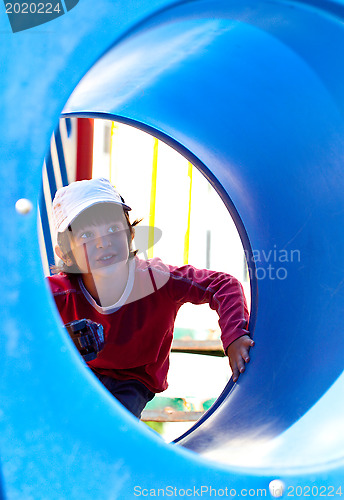 Image of smiling little boy in a baseball cap