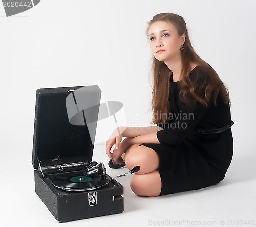 Image of Pretty woman with gramophone