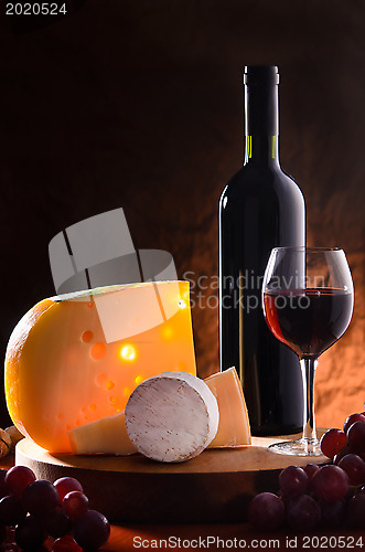 Image of Still-life with cheese, grape and wine.