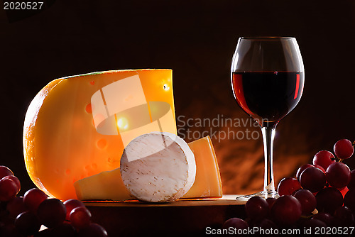 Image of Still-life with cheese, grape and wine.