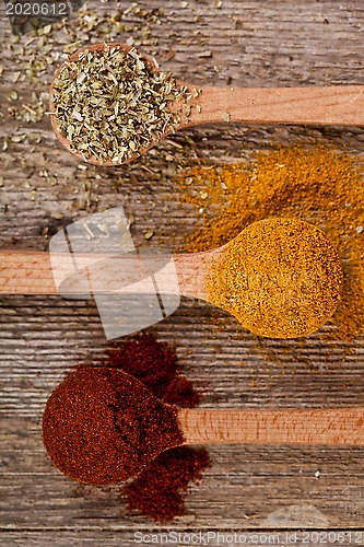 Image of spices in wooden spoons 