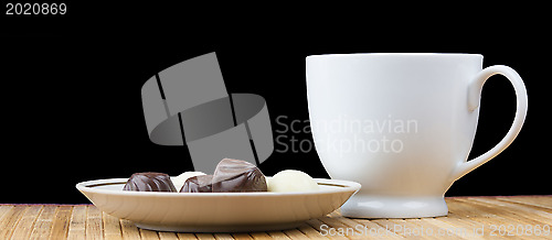 Image of cup and saucer sweet candy