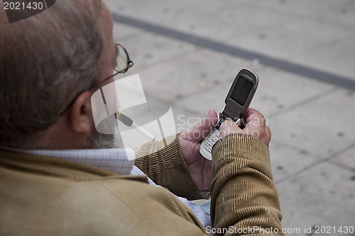 Image of Senior man with mobile