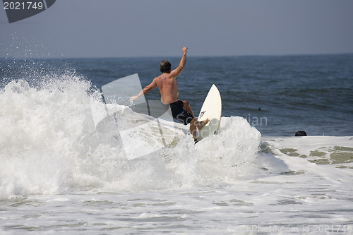 Image of Backlit surfer