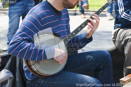 Image of Busker-Banjo player. 