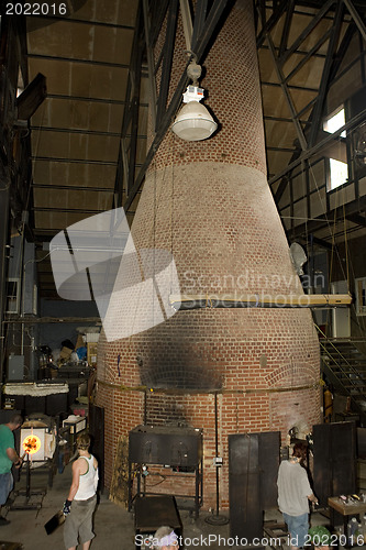 Image of Glass furnace. Glass Blower at Work