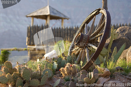 Image of Wagon wheel on yard of Fort Zion