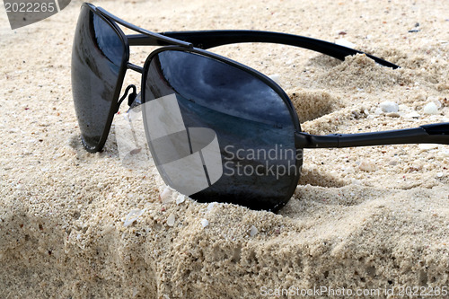 Image of Sunglasses on a sand