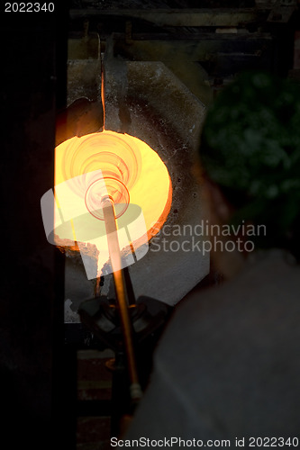 Image of Glass furnace. Glass Blower at Work