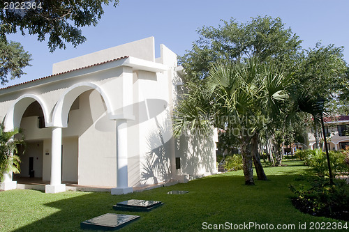 Image of View of house with tropical plants