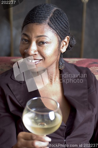 Image of beautiful black woman on sofa