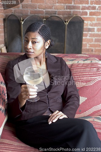 Image of beautiful black woman on sofa