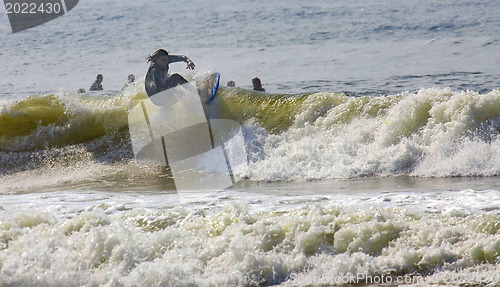 Image of Backlit surfer