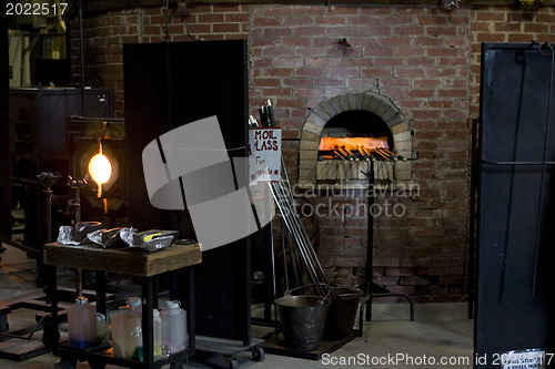 Image of Glass furnace. Glass Blower at Work