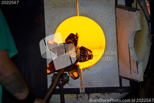 Image of Glass furnace. Glass Blower at Work