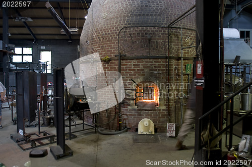 Image of Glass furnace. Glass Blower at Work