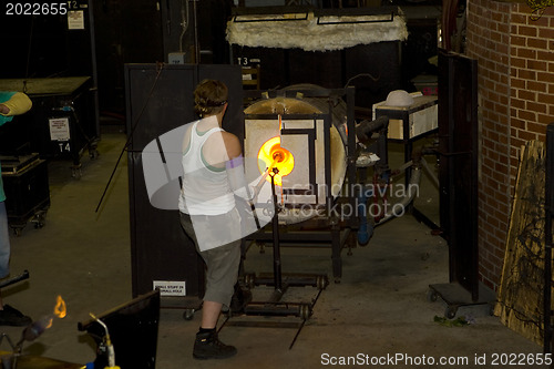 Image of Glass furnace. Glass Blower at Work