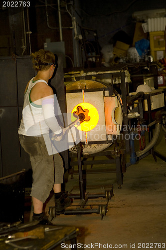 Image of Glass furnace. Glass Blower at Work