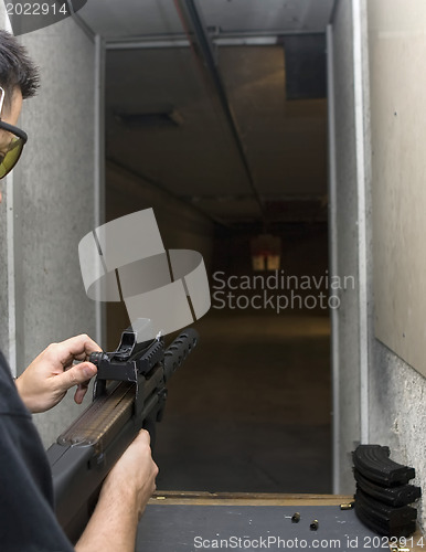Image of Target practicing with gun In the shooting range 