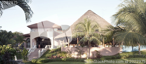 Image of View of house with tropical plants