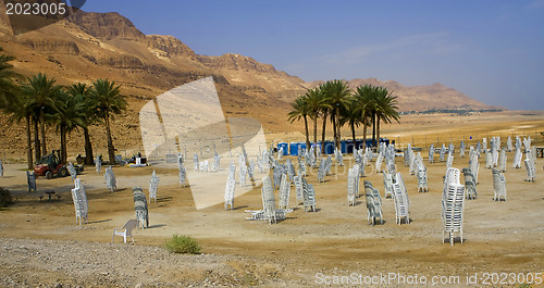 Image of Stocked chairs in a desert