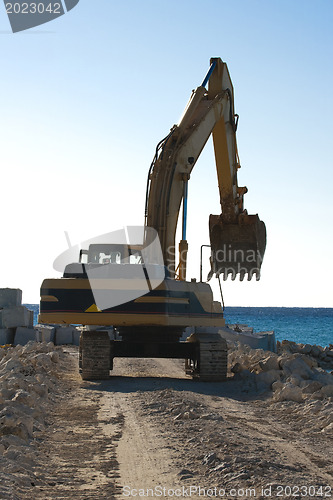Image of Yellow Excavator at Work
