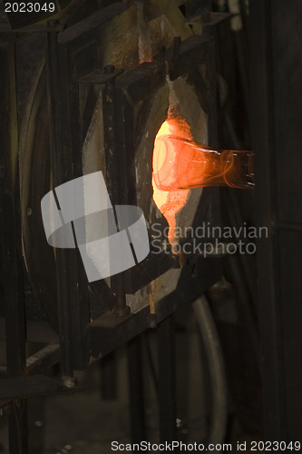 Image of Glass furnace. Glass Blower at Work