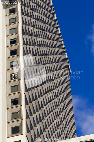 Image of Mahhattan .Urban view at modern glass building with  blue sky