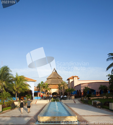 Image of Beautiful pool and patio in tropical setting 