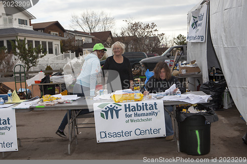 Image of NEW YORK - November 12: Volunteers and workers helping people af