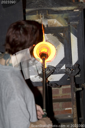 Image of Glass furnace. Glass Blower at Work