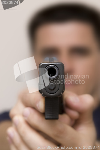 Image of Man pointing a gun.