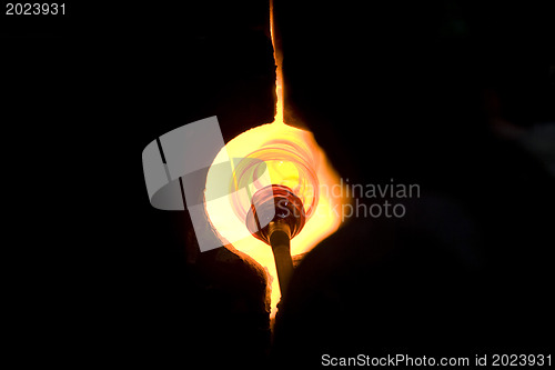 Image of Glass furnace. Glass Blower at Work