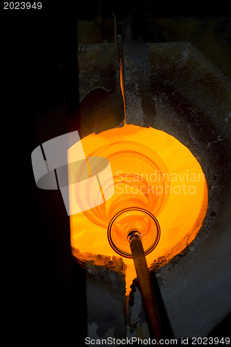 Image of Glass furnace. Glass Blower at Work