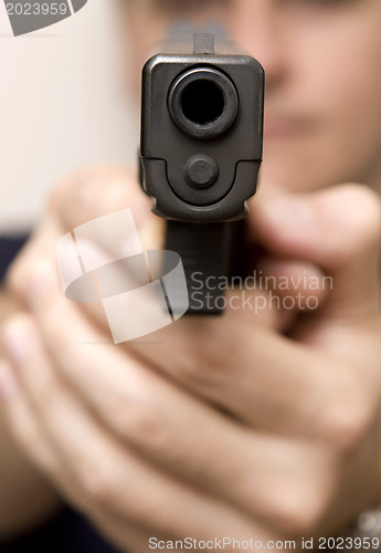 Image of Man pointing a gun.