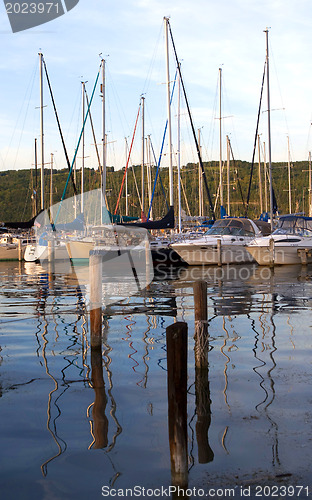 Image of Watkins Glen.  Sails boat in Senica lake at sunset 