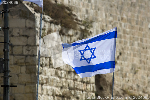 Image of Israel flag on the Western Wall background