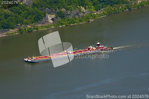 Image of A large carrying cargo ship on Hudson river 