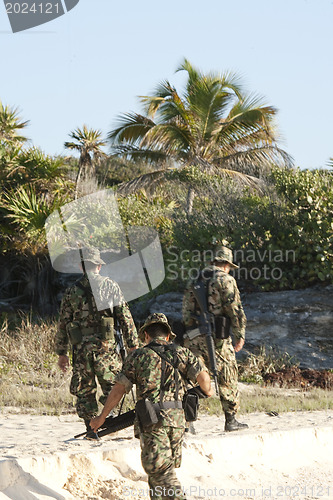 Image of MEXICO - FEBRUARY 7: Soldiers on duty checkinf the boarder on Fe