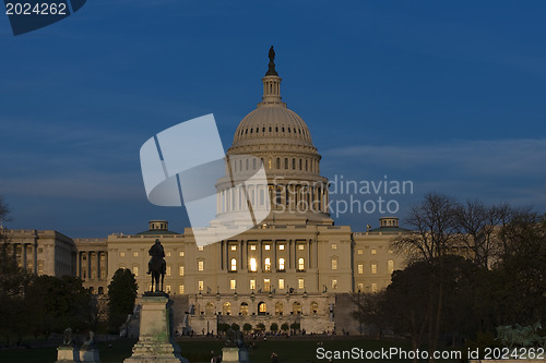 Image of The United States Capitol at night 