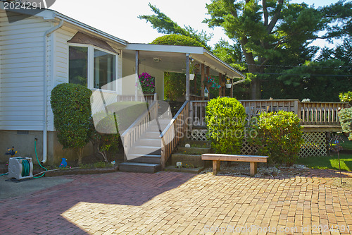 Image of Luxury family house with landscaping on the front and blue sky o