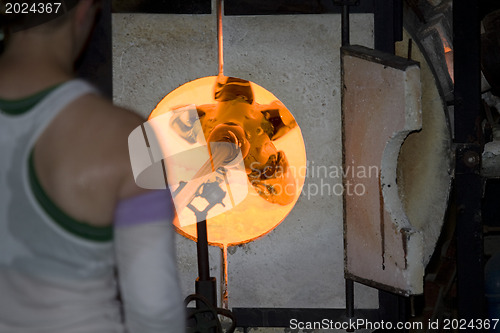 Image of Glass furnace. Glass Blower at Work