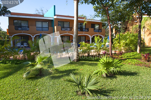 Image of View of house with tropical plants