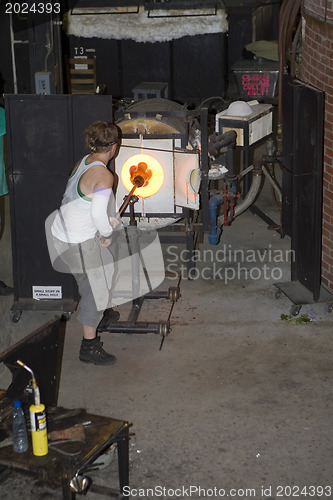 Image of Glass furnace. Glass Blower at Work